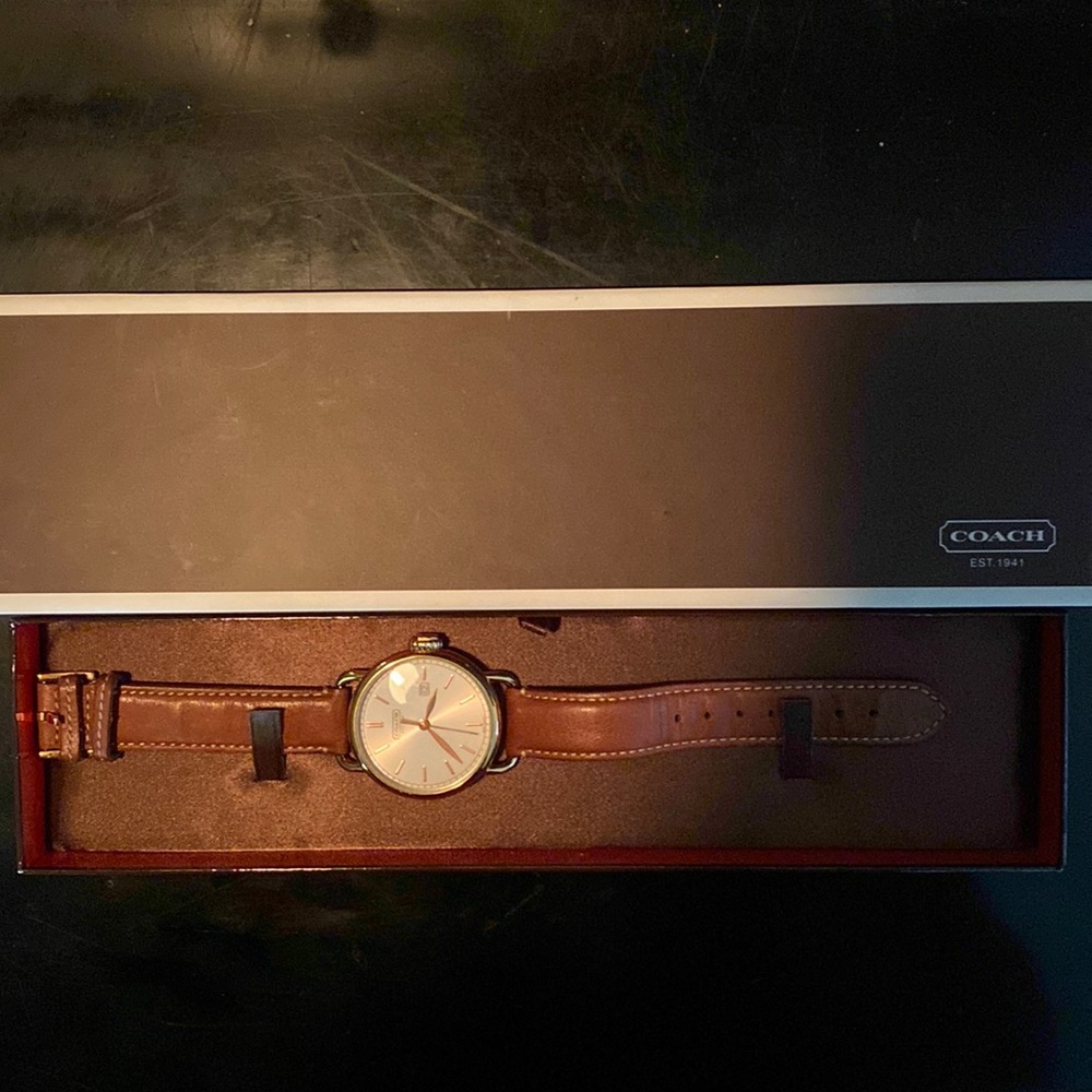Men’s COACH watch .